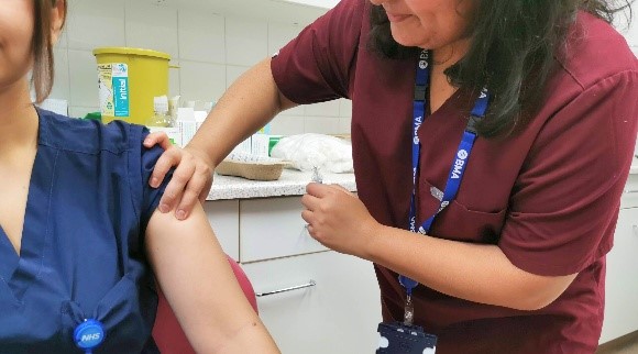 A patient receiving their vaccination